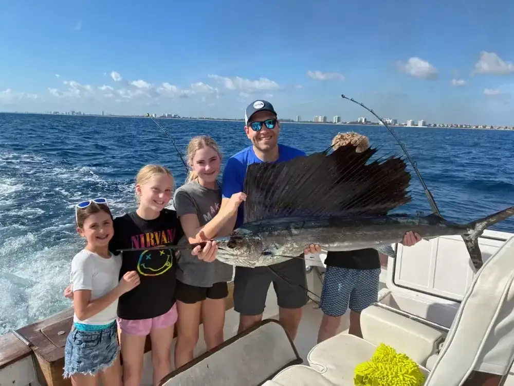 Anglers fishing from the cockpit of Don't Panic on an offshore charter from Hillsboro Inlet