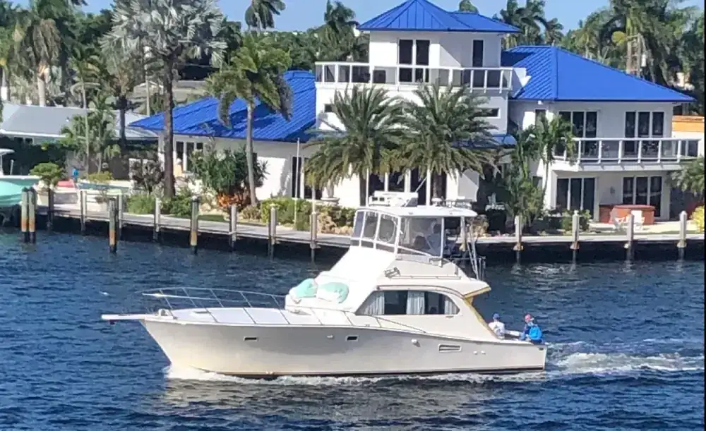 Don't Panic sportfishing boat heading out of Hillsboro Inlet on a calm Pompano Beach morning