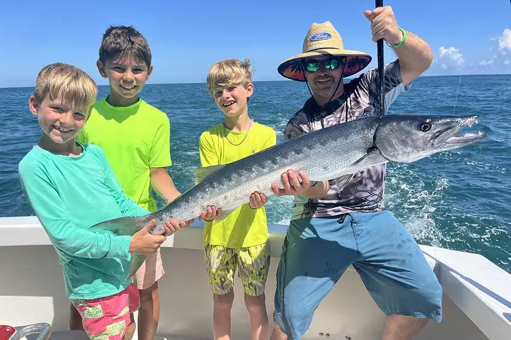 Fishing gloves, polarized sunglasses and a long-sleeve sun shirt on the deck of an offshore charter boat in Pompano Beach