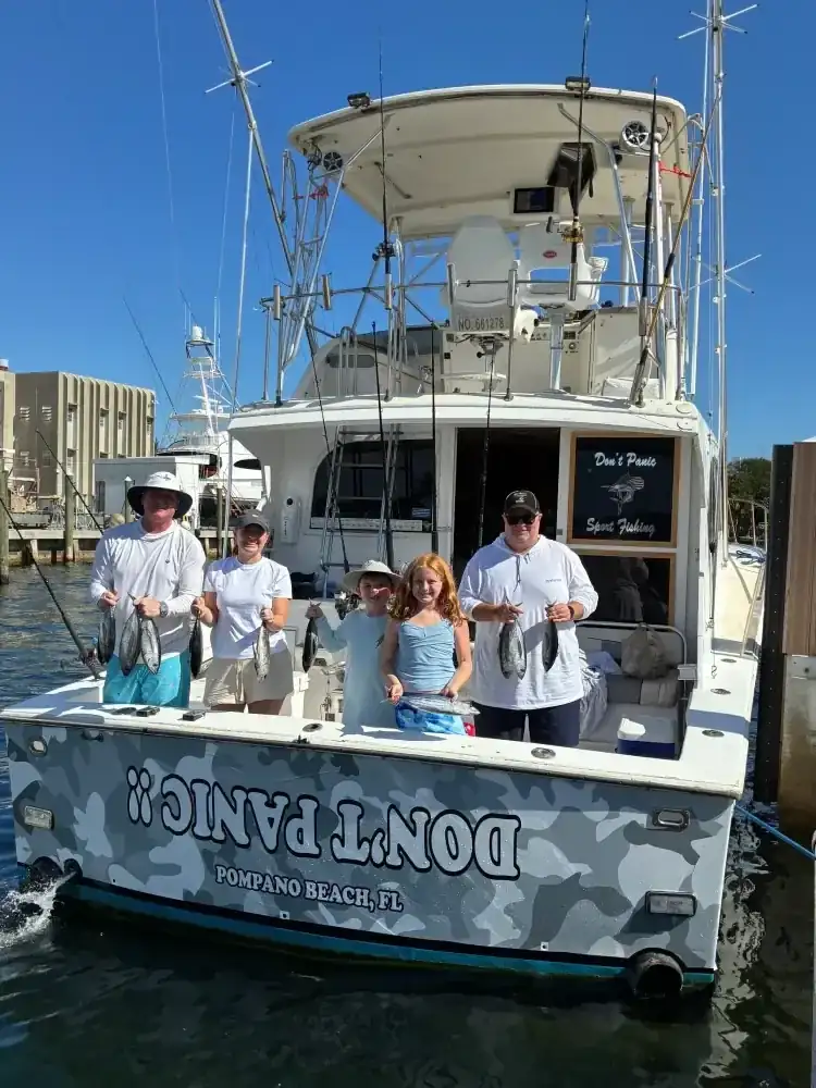 Anglers with their offshore catch on a Coconut Creek fishing charter - Don't Panic Sportfishing