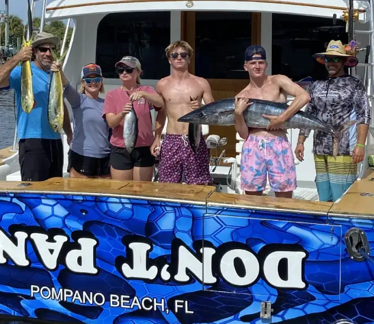 The Don't Panic crew with guests after an offshore fishing charter from Hillsboro Inlet