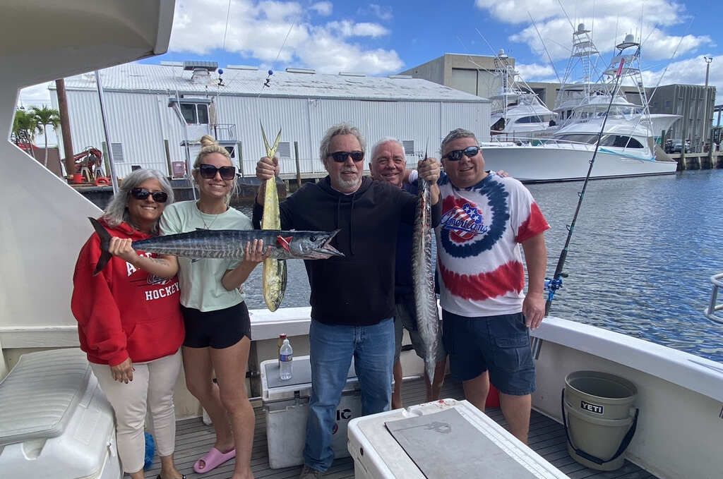 Guests enjoying their own food and drinks on a Pompano Beach fishing charter